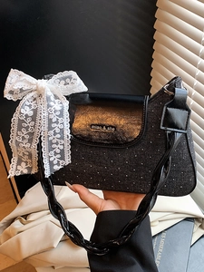 Fashionable black crossbody bag with white lace bow and sparkling rhinestones