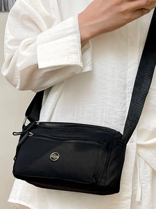 Minimalist black nylon crossbody bag for women with large capacity and adjustable strap