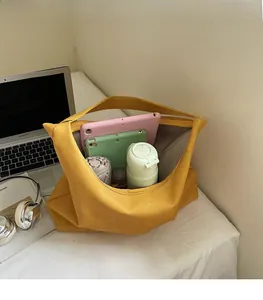 Large yellow felt tote bag interior showing ample space for umbrella and tablets