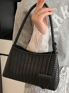 Handmade woven black shoulder bag with knotted handle and large capacity design