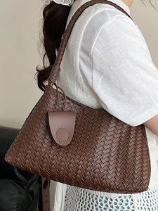 Deep coffee brown hand-woven leather tote bag with thick strap for stylish daily commuting