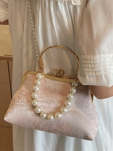 Pink vintage oriental clutch bag with pearl embroidery and circular metal handle