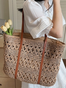 Hollow straw woven tote bag with brown PU straps for summer beach vacations and daily use