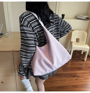 Lavender large hobo shoulder bag styled in a minimalist interior for daily commute