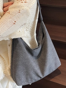 Fashion dark grey large capacity tote bag with contrast stitching on wooden stairs