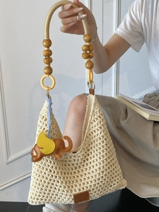 Handmade crochet summer beach bag with wooden beads handles and leather elephant charm