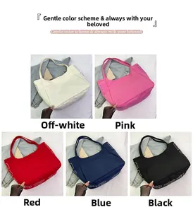 Detail view of five casual canvas tote bags in cream, pink, red, blue, and black colors