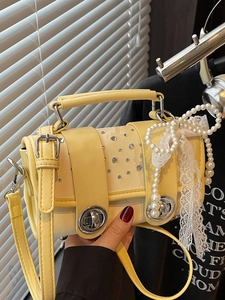 Fashionable pale yellow crossbody bag with pearl bow, lace ribbons and crystal accents