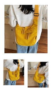 Detail view of bright yellow dumplings bag made of water-resistant nylon fabric