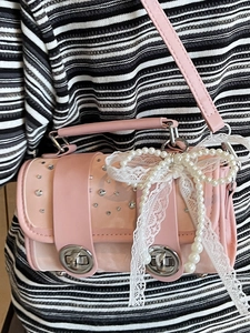 Pink vacation style crossbody beach bag with pearl bow and rhinestone flap detail