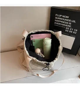 Macro view of the spacious beige canvas drawstring bag interior showing high capacity