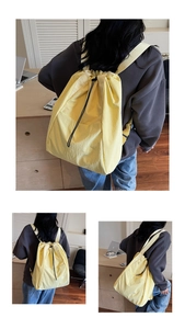 Detailed close-up showing the bright yellow drawstring backpack made of durable nylon