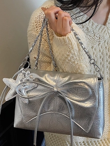Silver balletcore shoulder bag with pleated texture, bow detail and starfish charm