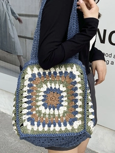 Handmade granny square crochet straw shoulder bag with multi-color geometric patterns