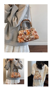 Detail of creative knit crossbody bag with bear decor and bamboo handle plus gold chain
