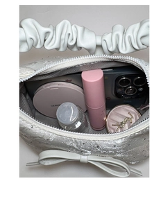 Top view of rhinestone bucket bag interior showing large capacity and bow detail