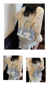 Detailed shot of contrast color tweed handbag with lace bow and elegant pearl charm