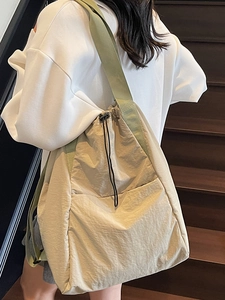 Minimalist nylon drawstring backpack in beige with olive green straps for women