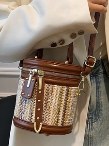 Fashionable woven bucket bag for women with leather trim and adjustable crossbody strap