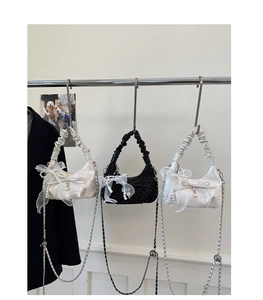 Three pleated half-moon bags with satin bows, pearl charms and chain straps display