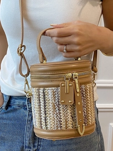 Fashionable brown leather woven bucket bag with gold zipper for women's casual crossbody style