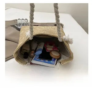 Top-down view of a straw tote bag interior showing its large storage capacity for items