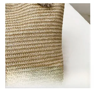 Close-up detail showing the fine texture of striped straw woven fabric for summer tote bags