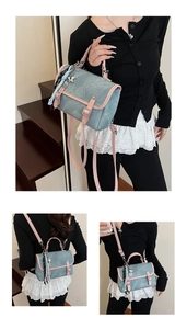 Detail of blue denim backpack with pink leather trim and star pendant tassel decor
