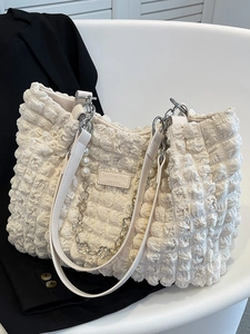 Chic cream ruched tote bag with bubble texture and floral chain strap for women