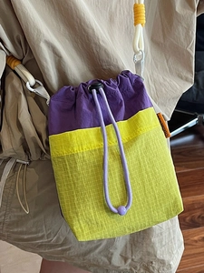 Fashionable color-block drawstring crossbody bag with purple and neon green grid fabric