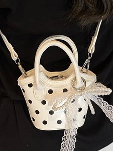 Mini white polka dot tote bag with lace bow charm and crossbody strap for summer fashion