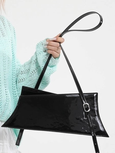 Modern black patent leather geometric shoulder bag with silver buckle and adjustable strap