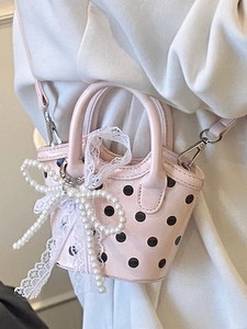 Pink polka dot mini crossbody bag with white pearl bow and lace trim for girls