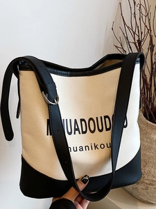 Large capacity canvas tote bag with black leather trim and chic letter print