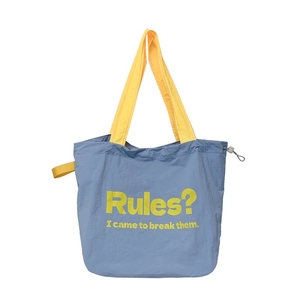 Blue and yellow contrast tote bag featuring a bold printed slogan and drawstring detail