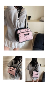 Pink quilted backpack with black bow embroidery and versatile straps for dual carrying modes