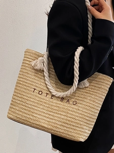 Summer woven tote bag with cotton rope handles and letters for beach vacation