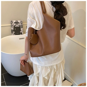 Brown lychee-patterned tote bag set with detachable coin purse and clutch on shoulder