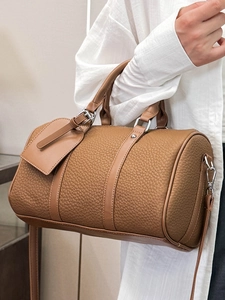 Classic brown Boston barrel bag in textured leather with silver-tone hardware and top handles