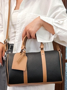 Classic black Boston style handbag with brown leather trim and silver metal hardware