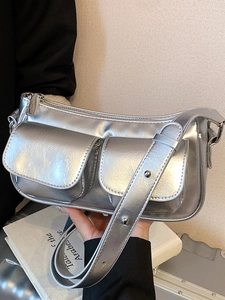 Silver metallic shoulder bag with cracked texture and front pockets for women