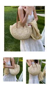 Detailed straw tote bag with radial hand-woven texture and brown leather shoulder straps