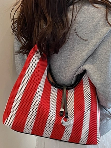 Fashionable red and white striped knit tote bag with black leather tassels and silver rings