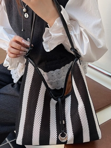 Fashionable black and white striped knit tote bag for women with silver ring detail