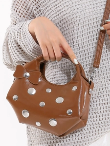 Brown patent leather crescent handbag with silver studs and bow decoration for women