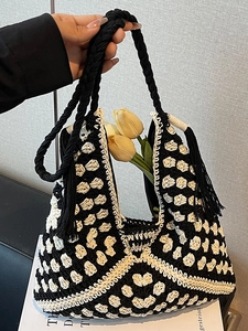 Handmade crochet woven tote bag in black and white with tassels for summer beach vacation