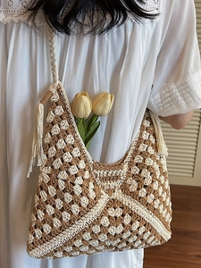 Handmade crochet tote bag with geometric patterns, thick braided strap and fringe details