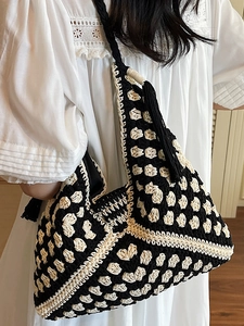 Large hand-woven contrast tote bag with geometric patterns and tassel detail