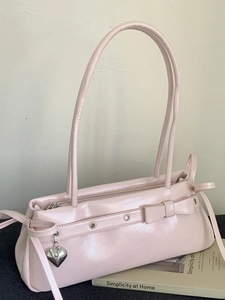 Pink patent leather handbag with bow detail and silver heart pendant for women