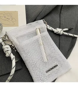 Detailed shot of white mesh phone bag featuring front pocket with pen storage detail